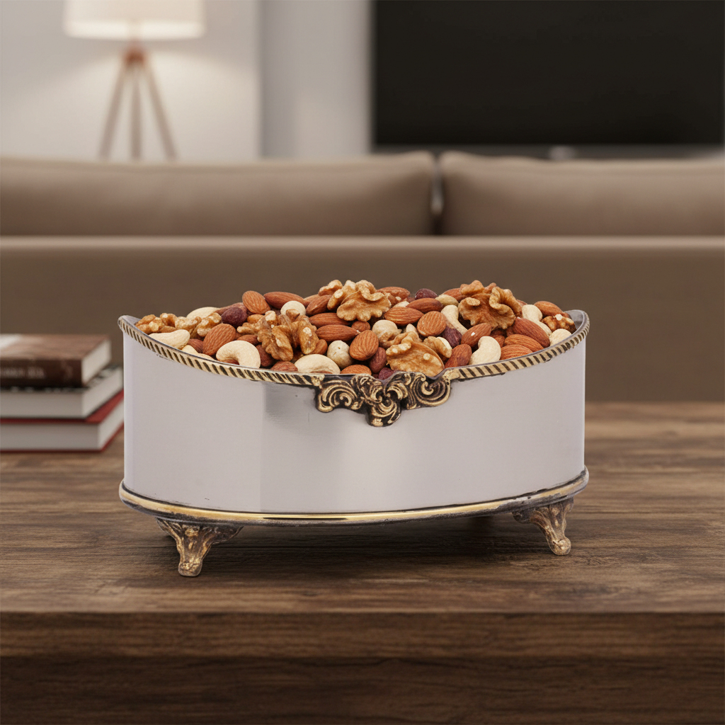 Oval bowl filled with walnuts, almonds, and cashews.