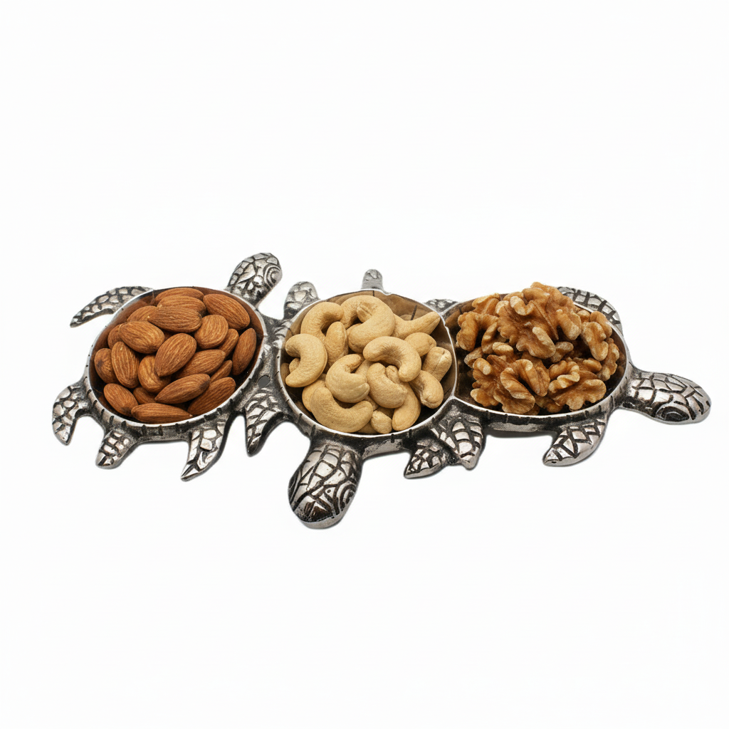 Tortoise-shaped holder with compartments filled with almonds, cashews, and walnuts on a white background
Serving bowl| Aluminum | 310001